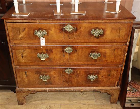 An 18th century and later walnut three drawer chest (formerly the base of a tallboy) W.100cm